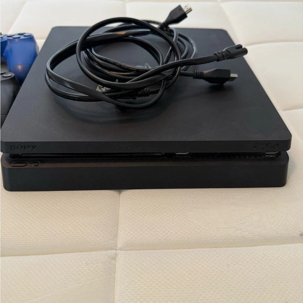 Sony PS4 Console with Blue and Black Controllers and 17 games